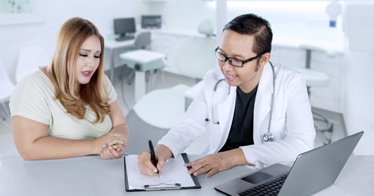 Doctor consulting with patient