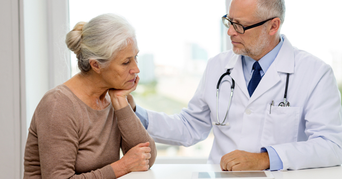 Doctor with depressed elderly patient