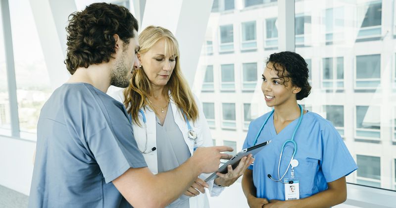 Three Doctors - One Young, One Older, One Black, Collaborating