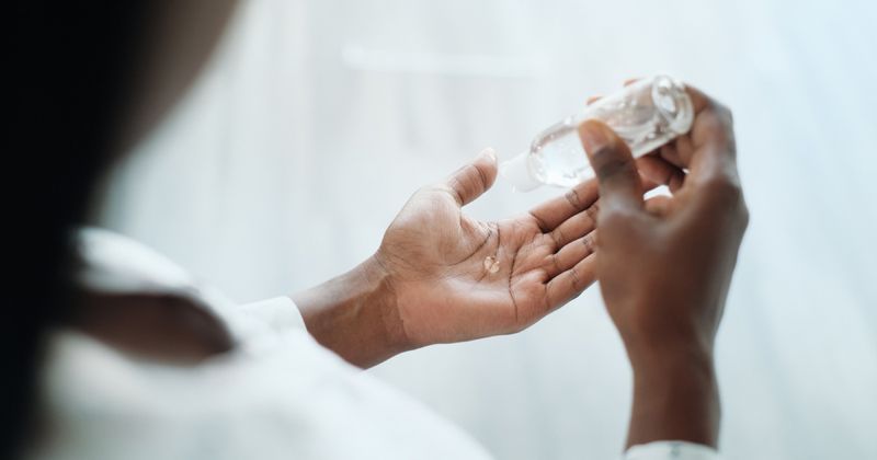 Hand sanitizer being used by woman