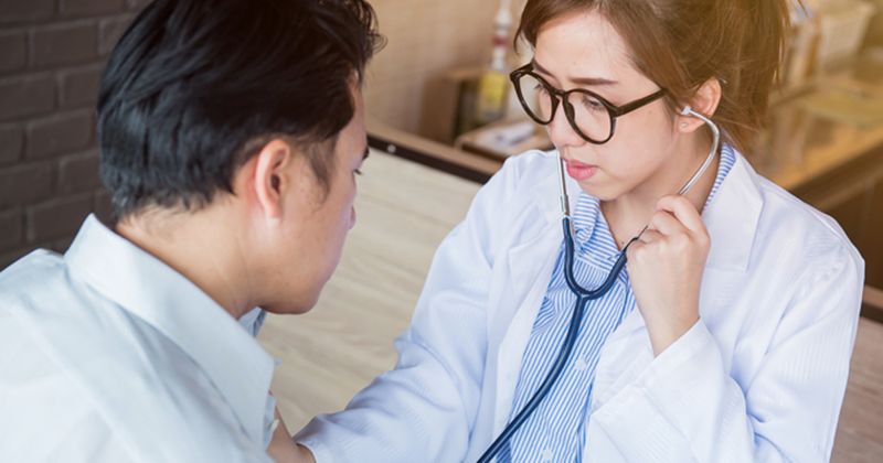 Man having heartbeat checked