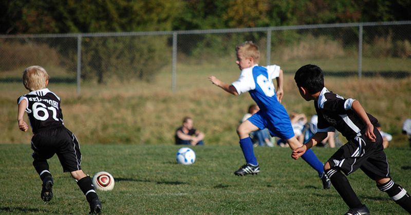 Children playing soccer