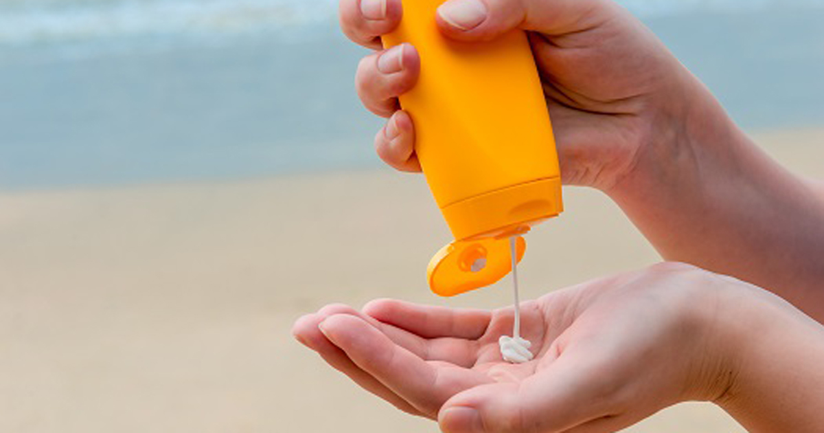 Sunscreen Squeezed Into a Person's Hands