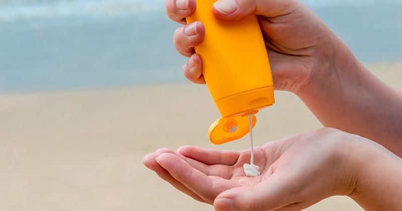 Sunscreen Squeezed Into a Person's Hands