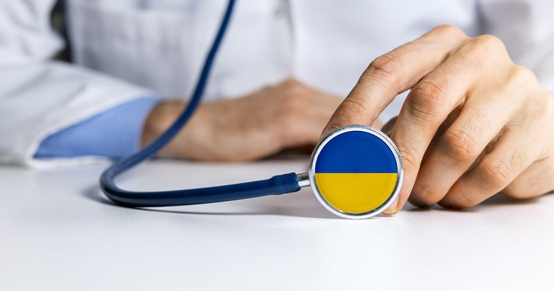 Ukrainian flag on stethoscope. Source: Adobe Stock.