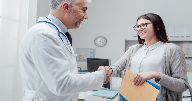 Doctor and patient shaking hands