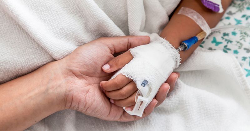 Photo of child hand with IV