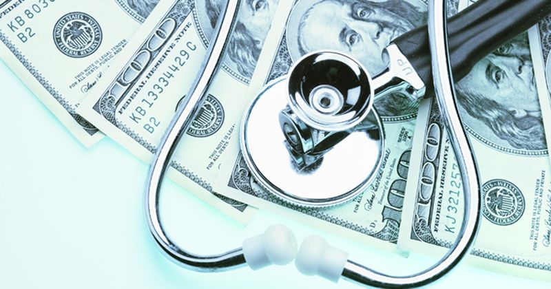 stock image showing money and stethoscope