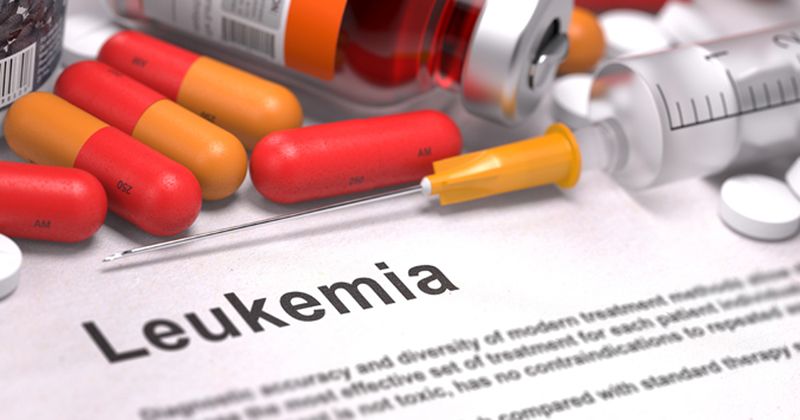 Leukemia diagnois text with pills and IV treatments