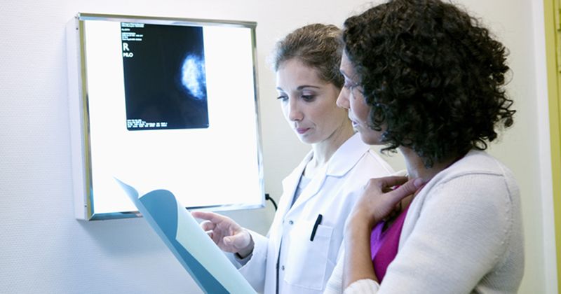 Photo of woman undergoing mammogram