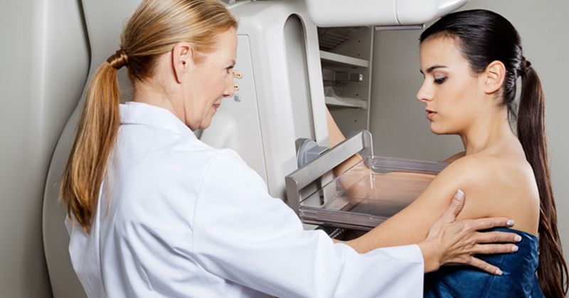 photo of woman undergoing mammogram