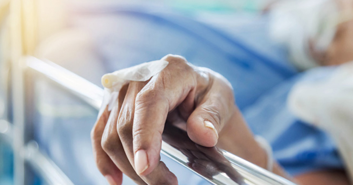 Photo of a patient in a hospital bed