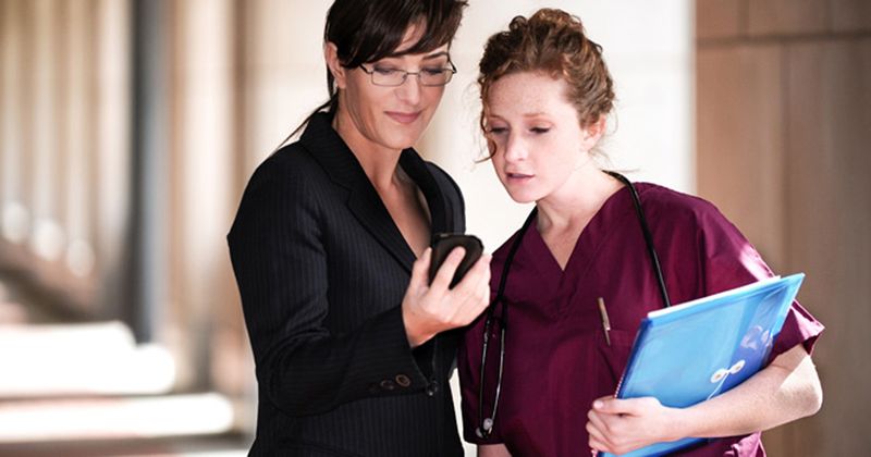 Photo of a nursing student with a cell phone