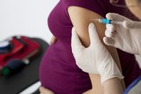 pregnant woman recieiving flu shot