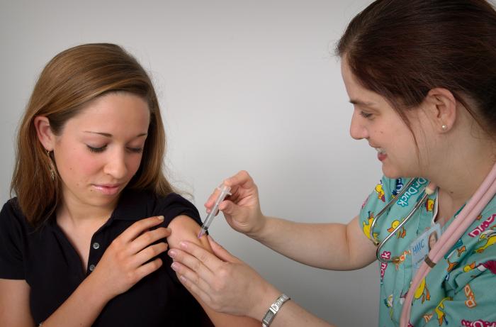 Photo of a girl getting a vaccine