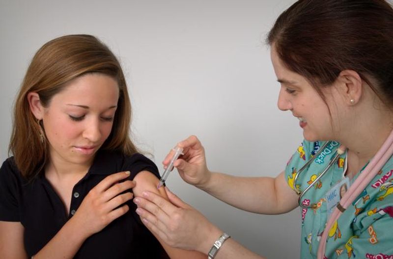 Photo of a girl getting a vaccine