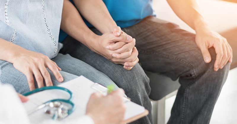 Consultation between couple and doctor