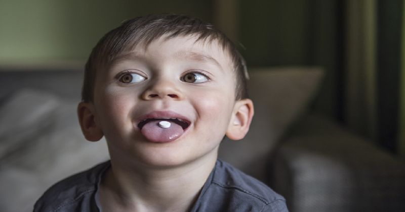 child swallowing pill