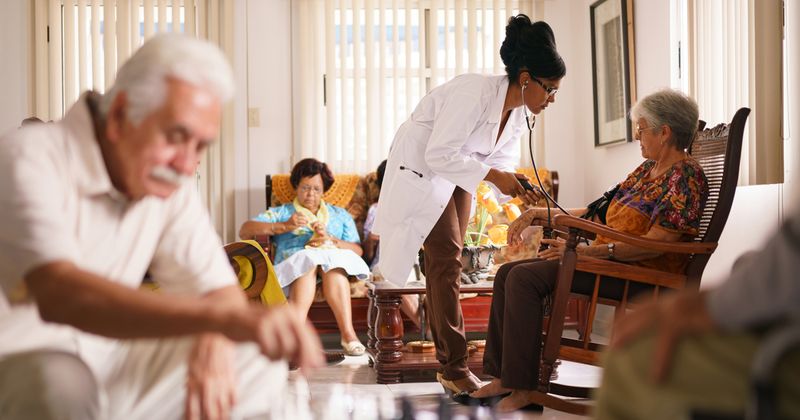 nurse with patients in hospice facility