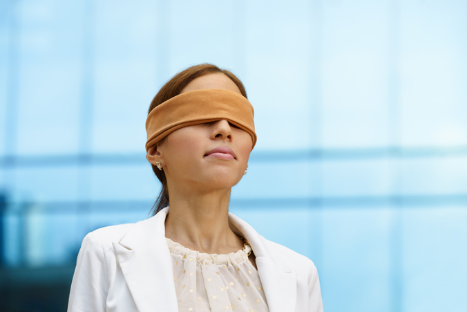 Photo of a blindfolded doctor