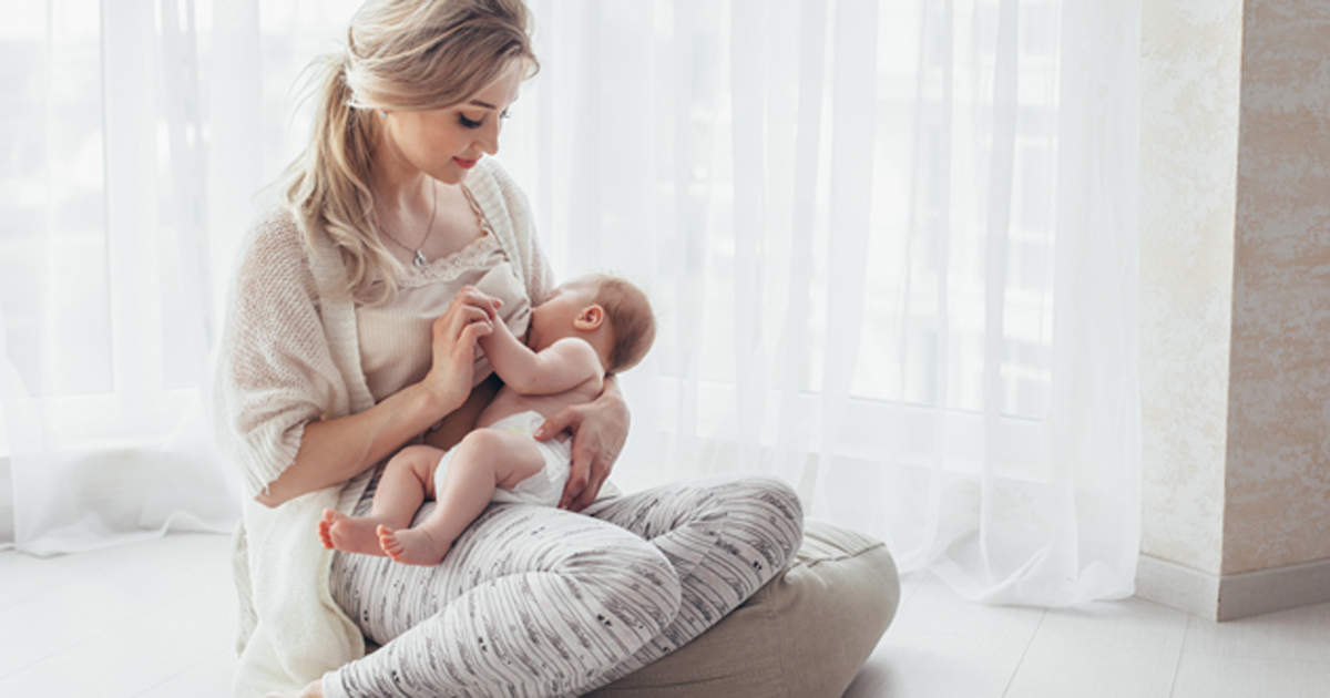 Mother breastfeeding her young infant