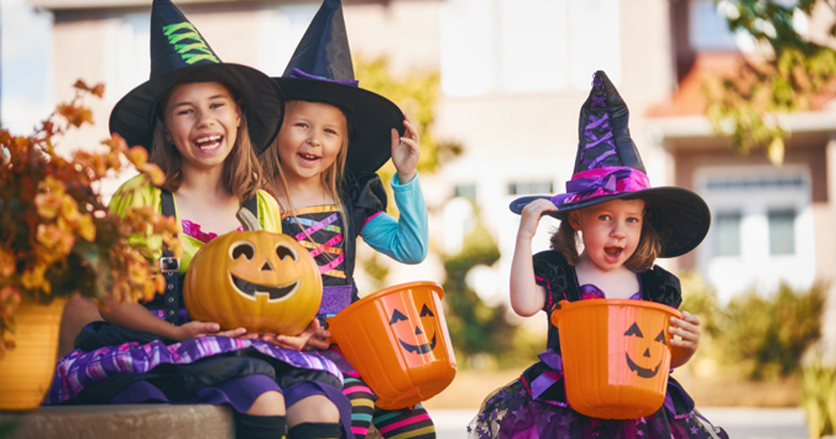 Kids dressed as witches on Halloween trick-or-treating