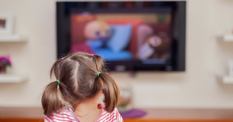 little girl watching TV