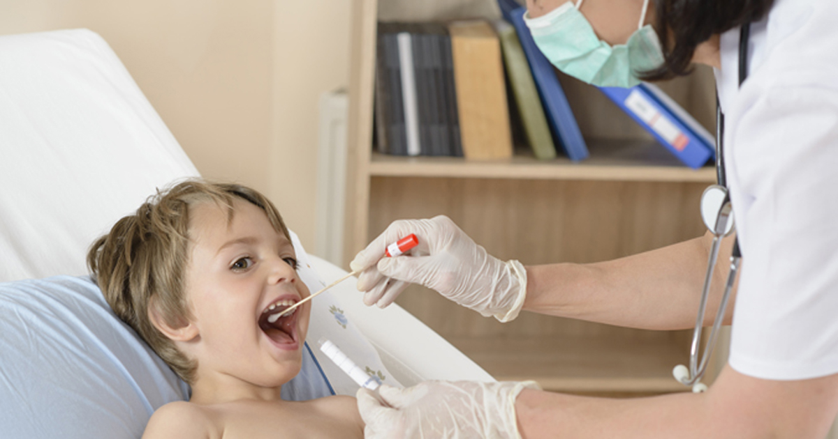 Photo of a child receiving a nasopharyngeal test