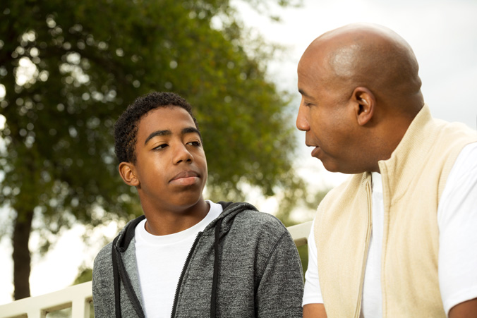 Parent speaks with teenage son