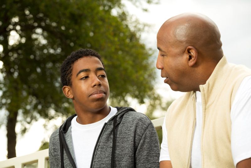 Parent speaks with teenage son