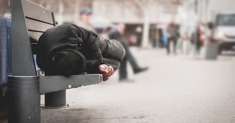 Image of homeless man on bench