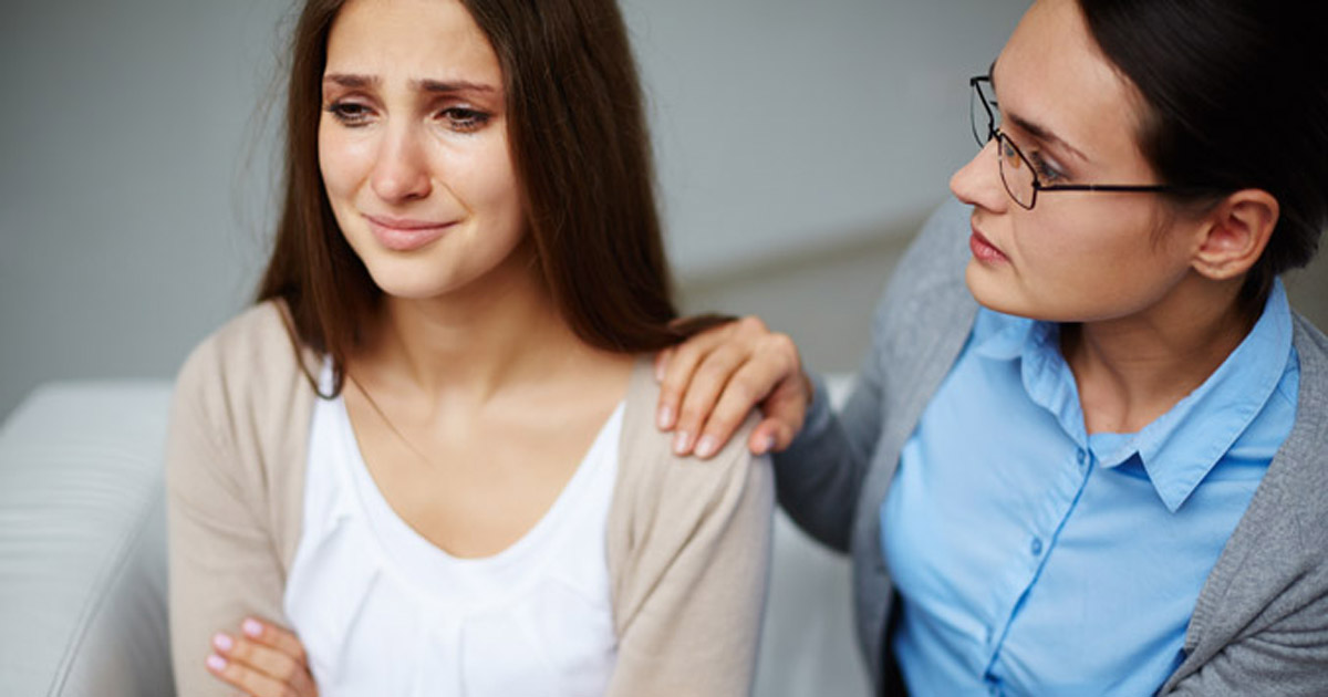 Comforting crying woman