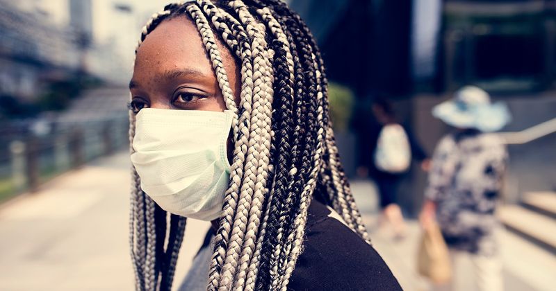 Black woman wearing a mask