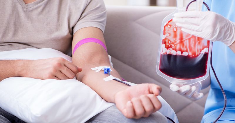 Patient getting blood transfusion in hospital.