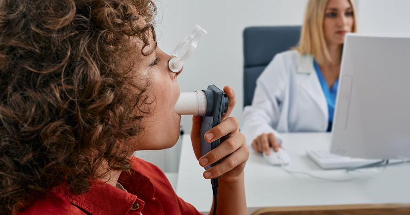 Child using spirometer