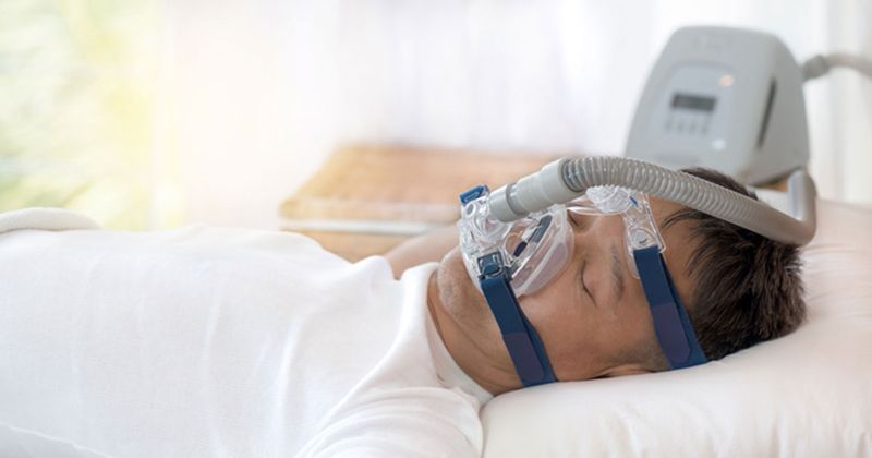 Man using CPAP