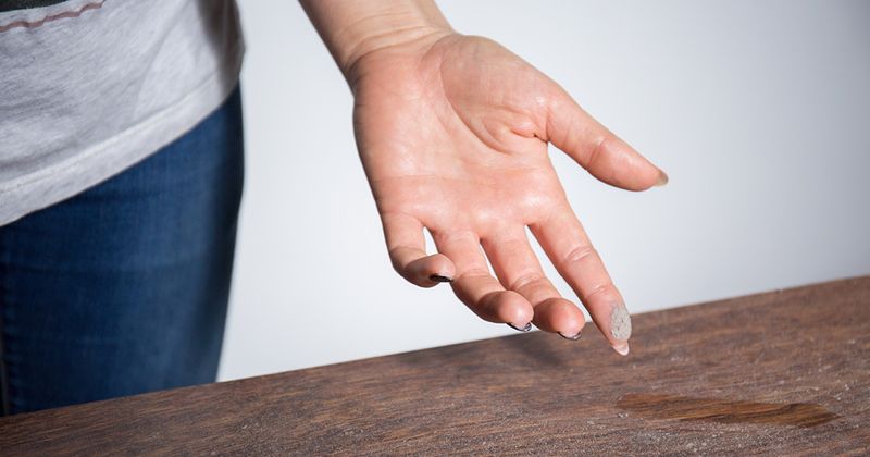 Close up of dust on person's finger