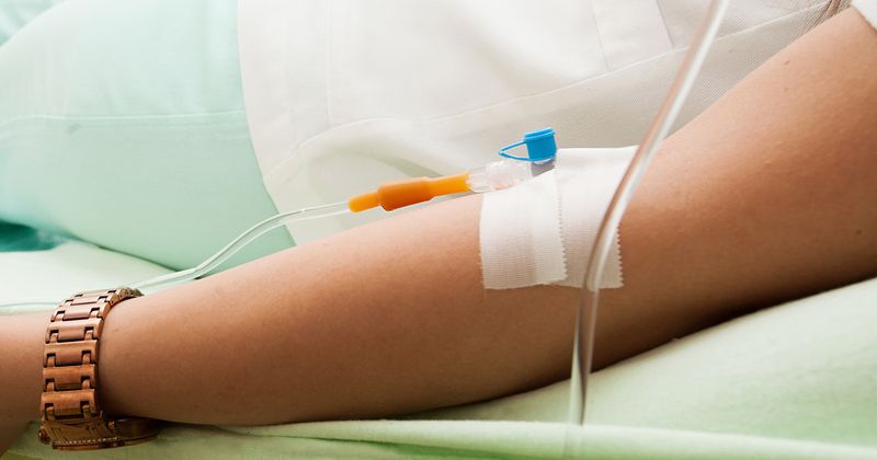 Patient receiving an infusion at clinic.