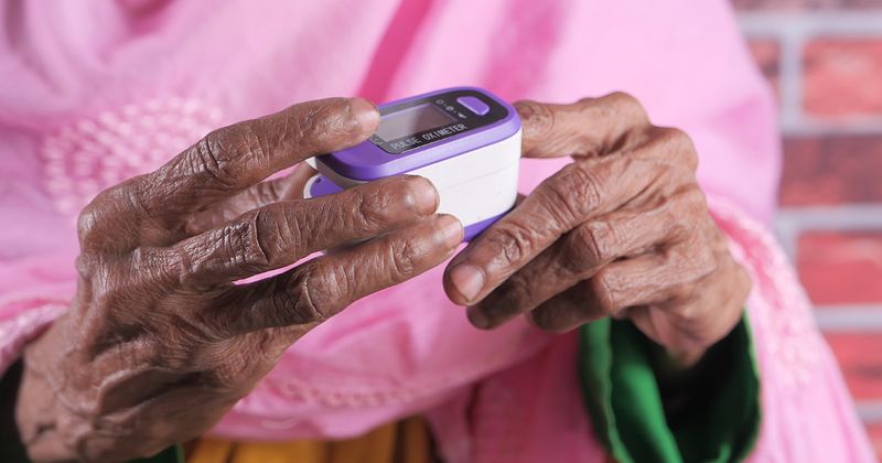 Person using a pulse oximeter