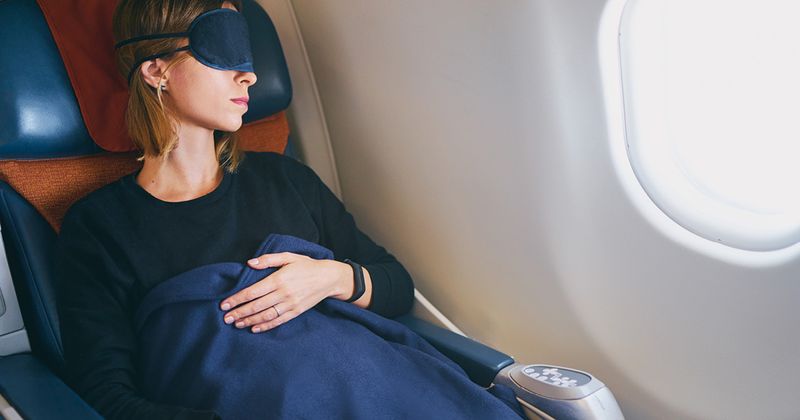 Woman sleeping on an airplane