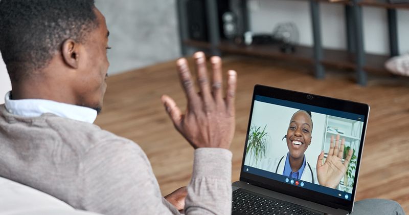 Black patients talking to a doctor over video call