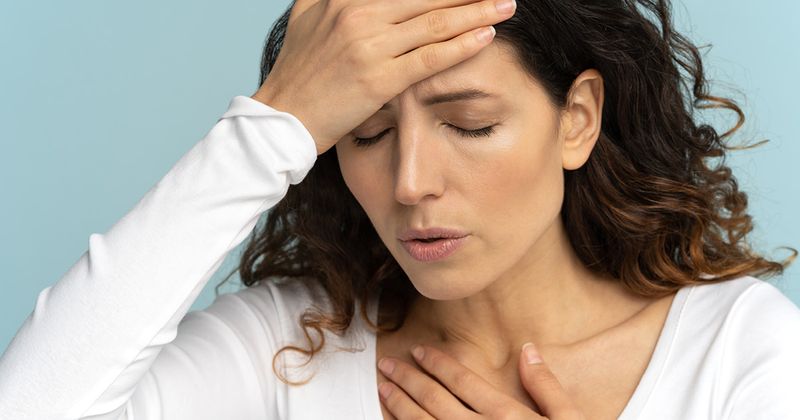 Woman having trouble breathing