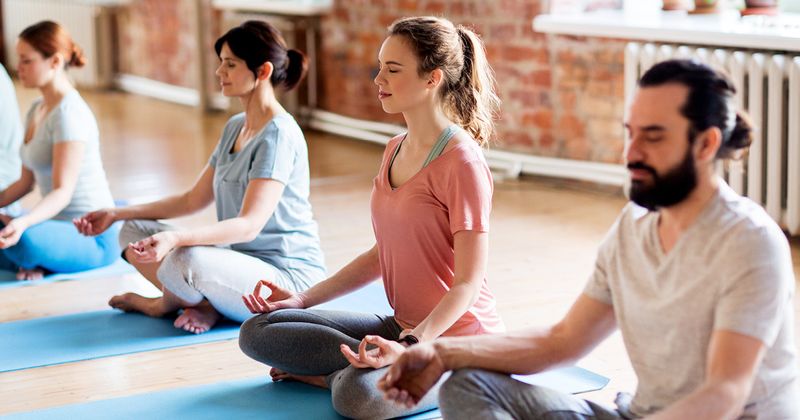 Group of people doing yoga