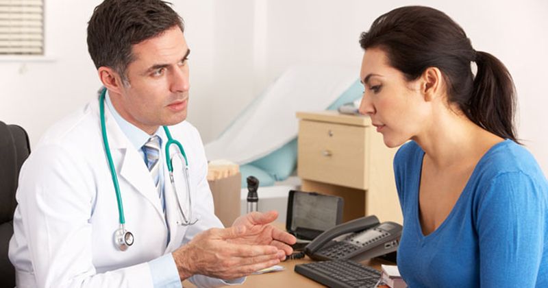 A doctor consults with a patient