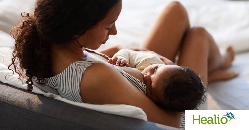 Black woman breastfeeding a baby