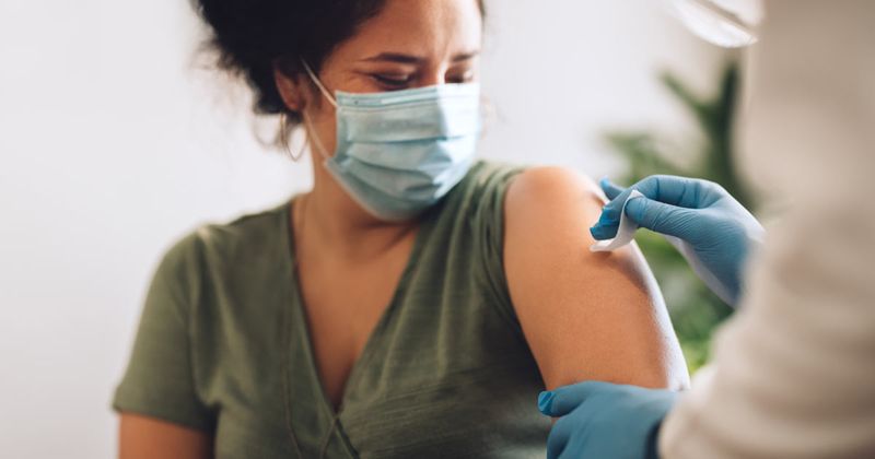 woman getting a vaccine shot