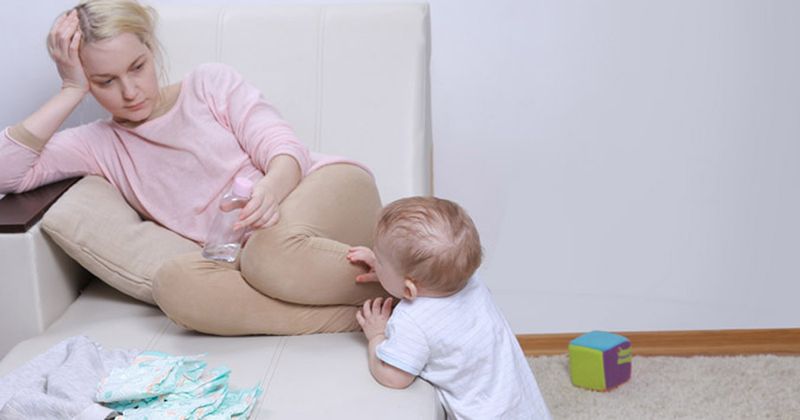 Mother and child in a room.