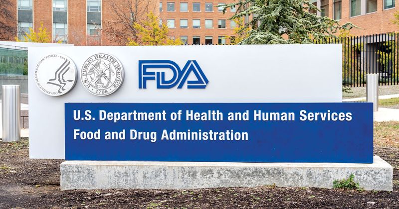 white and blue sign with FDA logo affixed