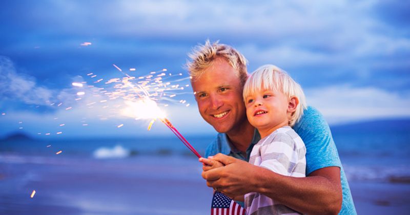 dad and child with sparkler