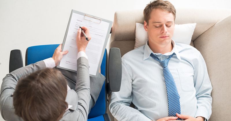 man on couch at psychiatrist's office